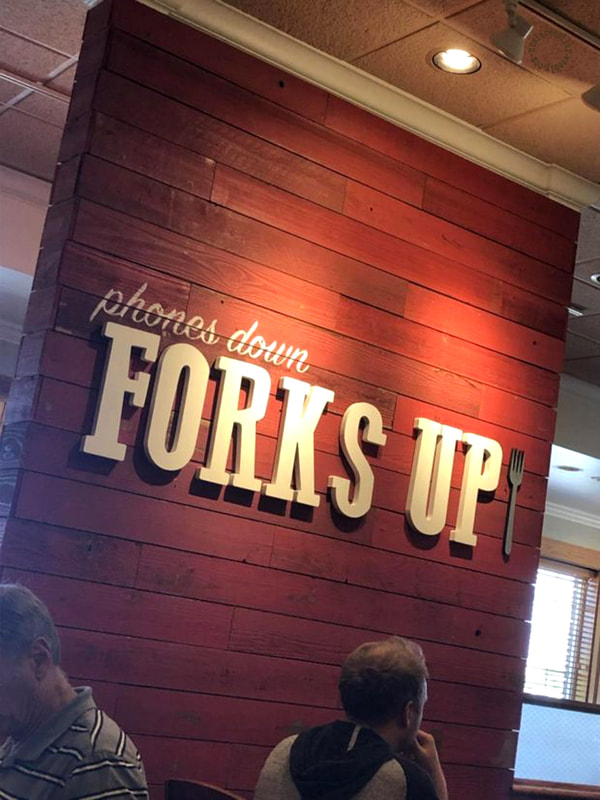 As seen at a restaurant - Phones down, forks up