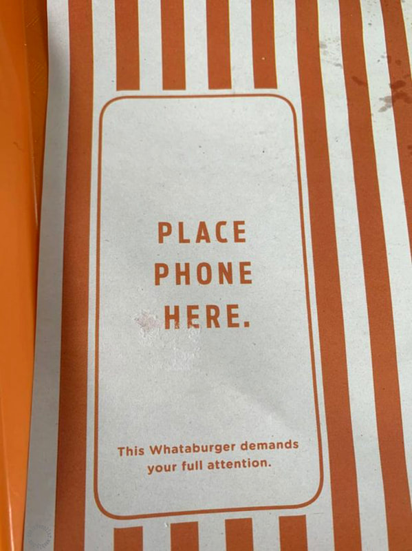 As seen at a burger restaurant - 'Place phone here. This Whataburger demands your full attention.'