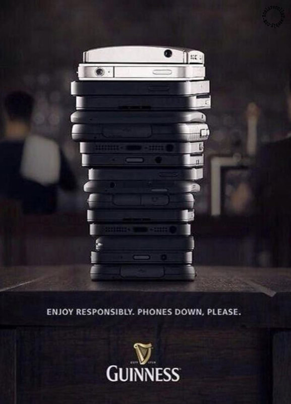 Guinness advertising - Enjoy responsibly. Phones down, please.