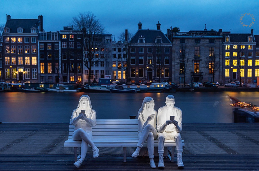 'Absorbed by Light' by Gali May Lucas is a sculpture displayed in Amsterdam, to highlight cellphone obsession and addiction