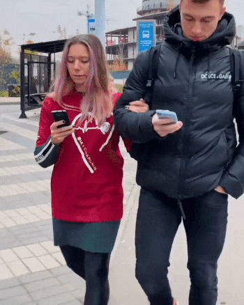 Street accident - distracted walking, distracted loving, distracted living! These two young people are unconscious and "absent", so wrapped are they in their phones…