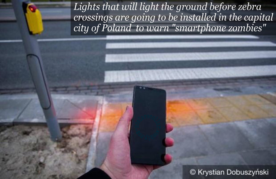 Lights that will light the ground before zebra crossings are going to be installed in the capital city of Poland to warn 'smartphone zombies'