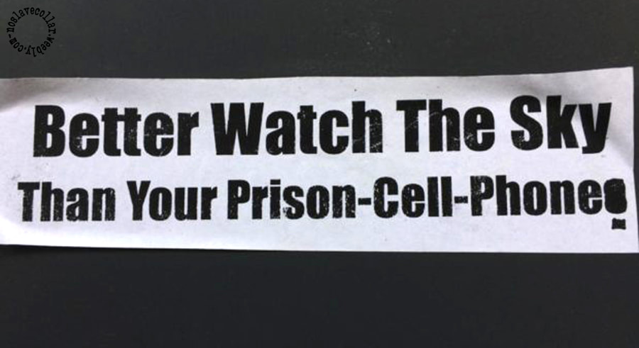 A sticker found on the street reads 'Better Watch The Sky Than Your Prison-cell-Phones'