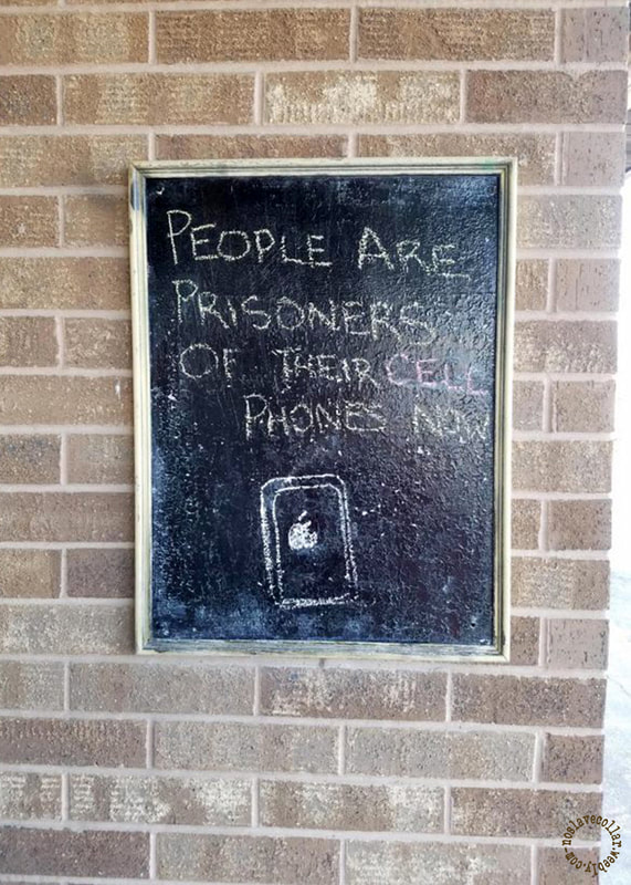 As seen at a local market - 'People are prisoners of their cell phones now'
