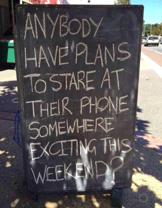 As seen near the road - 'Anybody has plans to stare at their phone somewhere exciting this week-end?'
