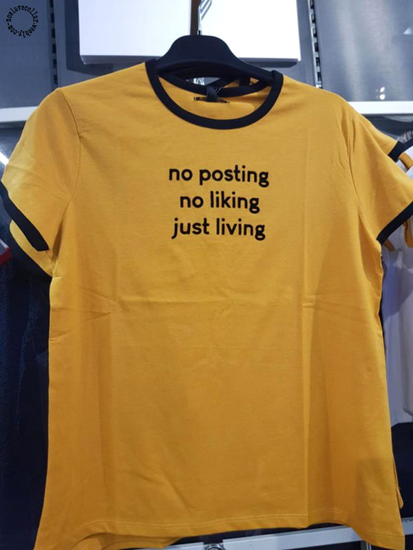 Yellow t-shirt reads 'No posting, no liking, just living'